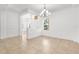 Bright foyer with chandelier lighting and tile flooring at 11603 Gramercy Park Ave, Bradenton, FL 34211