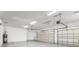 Spacious three-car garage with automatic door openers, concrete floors, and water heater at 11603 Gramercy Park Ave, Bradenton, FL 34211