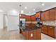 Well-equipped kitchen featuring modern appliances, a center island and plenty of space for cooking and gathering at 11603 Gramercy Park Ave, Bradenton, FL 34211