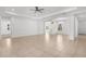 Expansive living area with tiled floors, modern lighting fixtures, and ample natural light at 11603 Gramercy Park Ave, Bradenton, FL 34211