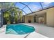 Relax in this screened-in pool, with access from the house to outdoor grill, promising endless summer fun at 11603 Gramercy Park Ave, Bradenton, FL 34211