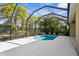This screened enclosure and swimming pool offers privacy with beautiful lush landscaping, perfect for a relaxing afternoon swim at 11603 Gramercy Park Ave, Bradenton, FL 34211