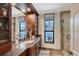 Bathroom with granite countertops, double sinks, and modern fixtures, offering a luxurious experience at 1188 Tahiti Pkwy, Sarasota, FL 34236