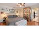 Comfortable main bedroom with hardwood floors, closet doors, and ceiling fan at 1188 Tahiti Pkwy, Sarasota, FL 34236