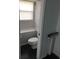 Small bathroom with toilet and built-in shelf at 1211 Peridot Lane, Sun City Center, FL 33573