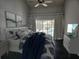 Bright bedroom with a view of the pool and outdoor seating area at 1211 Peridot Lane, Sun City Center, FL 33573