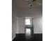Spacious bedroom with dark floors leads to ensuite bathroom with tub and lots of natural light at 1211 Peridot Lane, Sun City Center, FL 33573