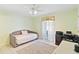 This bedroom offers a comfortable daybed, a working desk and a fan to keep you cool at 1216 Yawl Way, Venice, FL 34285