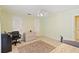 This bedroom includes a closet, light green walls and a tan tile floor at 1216 Yawl Way, Venice, FL 34285