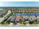 Beautiful aerial view of the home showcasing its location and nearby lake at 13214 Treviso Dr, Bradenton, FL 34211