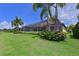 Lush backyard featuring a screened-in patio and vibrant landscaping, perfect for outdoor living at 13214 Treviso Dr, Bradenton, FL 34211
