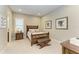 Comfortable bedroom design featuring wood accents, neutral tones, and natural light at 13214 Treviso Dr, Bradenton, FL 34211
