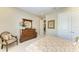 Nicely decorated bedroom featuring a dresser, chair, and mirror at 13214 Treviso Dr, Bradenton, FL 34211