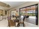 Charming breakfast nook featuring views of the outdoor lanai and pool, with a glass table at 13214 Treviso Dr, Bradenton, FL 34211