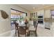 Cozy breakfast nook with a glass table, overlooking the outdoor lanai and pool area at 13214 Treviso Dr, Bradenton, FL 34211