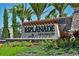 Elegant Esplanade Golf & Country Club community sign surrounded by lush landscaping and palm trees at 13214 Treviso Dr, Bradenton, FL 34211