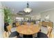 Bright dining area connecting to an open-concept kitchen and living space at 13214 Treviso Dr, Bradenton, FL 34211