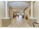 Welcoming foyer with tile flooring, architectural columns, and views of the living spaces at 13214 Treviso Dr, Bradenton, FL 34211