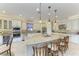 Open kitchen showcasing a large island with seating, stainless steel appliances, and ample counter space at 13214 Treviso Dr, Bradenton, FL 34211
