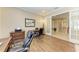 Spacious home office includes wood floors, large desk, and bright lighting at 13214 Treviso Dr, Bradenton, FL 34211
