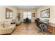 Home office boasts wood floors, plantation shutters, two desks and comfortable seating at 13214 Treviso Dr, Bradenton, FL 34211