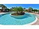 Unique pool with central island, palm trees, lounge seating and clear blue water at 13214 Treviso Dr, Bradenton, FL 34211