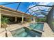 Stunning screened-in pool and spa area with ample seating for outdoor relaxation and entertainment at 13214 Treviso Dr, Bradenton, FL 34211