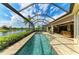 Enjoy Florida outdoor living on your screened patio overlooking the pool and stunning lake views at 13214 Treviso Dr, Bradenton, FL 34211