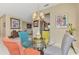 Dining area features a glass table with colorful chairs, connecting to the living room and kitchen at 1345 Burgos Dr # 101, Sarasota, FL 34238