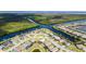Aerial view of a waterfront community, showcasing homes along canals with private docks and boat access at 14540 Gaspar Loop, Port Charlotte, FL 33981