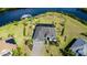 Aerial view of a waterfront home showcasing a spacious lot and private boat dock at 14540 Gaspar Loop, Port Charlotte, FL 33981