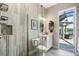 Bathroom featuring a glass-enclosed shower, sleek vanity, and an outside view to the lanai and water at 14540 Gaspar Loop, Port Charlotte, FL 33981