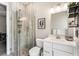 Modern bathroom featuring a glass enclosed shower, tile floors, and a white vanity with decorative accents at 14540 Gaspar Loop, Port Charlotte, FL 33981