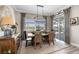 Well-lit dining area with a sliding glass door and views of the outdoor pool at 14540 Gaspar Loop, Port Charlotte, FL 33981