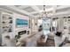 Cozy living room with coffered ceilings, fireplace, built-in shelves, and stylish decor at 14540 Gaspar Loop, Port Charlotte, FL 33981