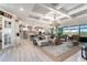 Inviting living area featuring stylish decor, coffered ceilings, and an open layout at 14540 Gaspar Loop, Port Charlotte, FL 33981