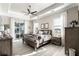 Spacious main bedroom with tray ceilings, natural light, and a view of the backyard at 14540 Gaspar Loop, Port Charlotte, FL 33981