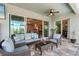 Cozy patio with comfortable seating that has a view of the interior with large sliding doors at 14540 Gaspar Loop, Port Charlotte, FL 33981