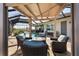 Cozy poolside seating with a fire pit provides a relaxing ambiance in the screened-in lanai at 14540 Gaspar Loop, Port Charlotte, FL 33981