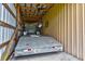 Barn interior with metal walls and rafters; car hauler is parked inside at 15890 County Road 675, Parrish, FL 34219