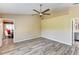Bright bedroom featuring hard wood floors, ceiling fan and neutral paint color at 15890 County Road 675, Parrish, FL 34219