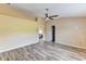 Neutral toned main bedroom featuring hard wood floors, ceiling fan and two entrances at 15890 County Road 675, Parrish, FL 34219
