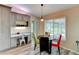 Inviting dining area with a view of the backyard, adjacent to the desk nook and kitchen at 15890 County Road 675, Parrish, FL 34219