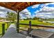 Scenic view from dock with pond, fountain, lush greenery, and benches for enjoying peaceful waterfront views at 15890 County Road 675, Parrish, FL 34219