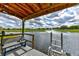 Beautiful view from dock with pond, water feature and seating, perfect for lakeside enjoyment and relaxation at 15890 County Road 675, Parrish, FL 34219