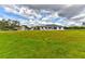 Sprawling green lawn surrounds this single-story home with a large garage providing ample parking at 15890 County Road 675, Parrish, FL 34219
