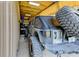 Garage interior featuring a customized Jeep with roll cage and large off-road tires at 15890 County Road 675, Parrish, FL 34219