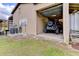 Exterior view of garage featuring Jeep, air compressor, hose and storage at 15890 County Road 675, Parrish, FL 34219