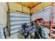 Spacious garage with a motorcycle, storage and insulated walls at 15890 County Road 675, Parrish, FL 34219