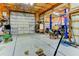 Spacious garage interior with car lift and ample room for storage and vehicle maintenance at 15890 County Road 675, Parrish, FL 34219